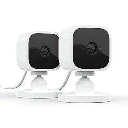 Blink Mini - Compact indoor plug-in smart security camera, 1080p HD video, night vision, motion detection, two-way audio, easy set up, Works with Alexa – 2 cameras (White)